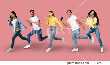 In Motion Shot Of Diverse Multiethnic People Running With Smartphones In Hands In Motion Shot Of Diverse Multiethnic People Running With Smartphones In Hands 99425152