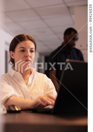 Marketing specialist planning strategy on corporate laptop, project manager typing on computer. Employee analyzing financial report, busy company worker sitting at workplace desk Marketing specialist planning strategy on corporate laptop, project manager typing on computer. Employee analyzing financial report, busy company worker sitting at workplace desk 99426839