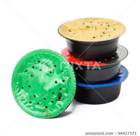 Used coffee capsules for coffee machine on a white background, plastic packaging 99427371
