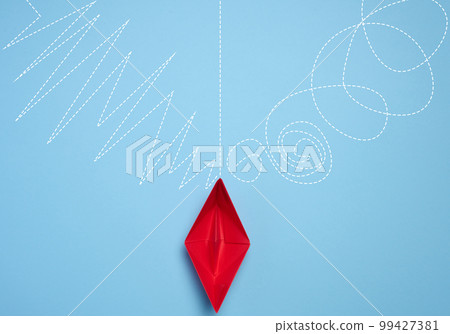A red paper boat stands in front of different paths, the concept of finding the optimal route, top view 99427381