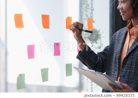 Accountant black woman working on financial document, tax, exchange, accounting and Financial advisor concept 99428335