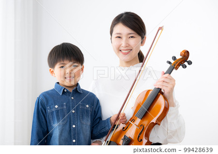 violin teacher and children violin teacher and children 99428639