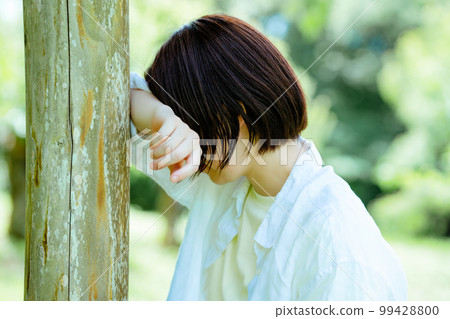 Depressed woman who came to a fresh green park for a change Depressed woman who came to a fresh green park for a change 99428800