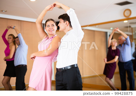 young women with partner dance samba 99428875