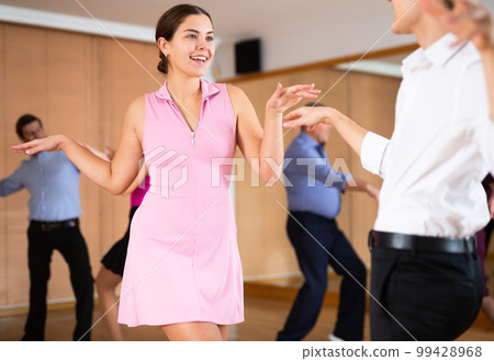 young woman dances salsa 99428968