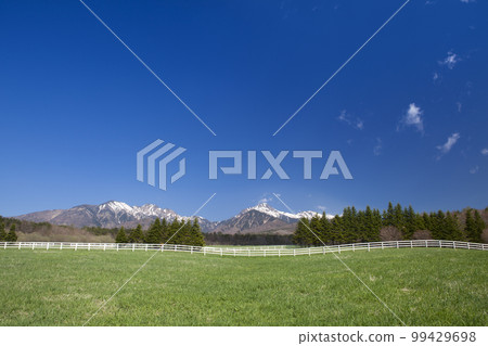 Yatsugatake with remaining snow and Keep Association Ranch 99429698