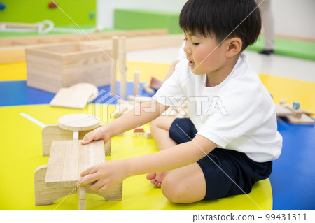 Children playing building blocks Children playing building blocks 99431311