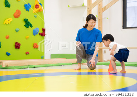 Children exercising in nursery school or kindergarten Children exercising in nursery school or kindergarten 99431338
