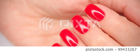 Female hands with beautiful bright red nails closeup Female hands with beautiful bright red nails closeup 99433267