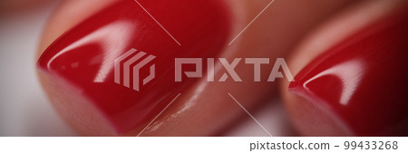 Fashionable red nail manicure in beauty salon Fashionable red nail manicure in beauty salon 99433268