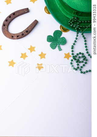 Top view photo of st patrick's day decorations with copy space on white background Top view photo of st patrick's day decorations with copy space on white background 99433318