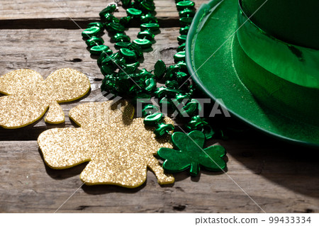 Top view photo of st patrick's day decorations with copy space on wooden surface 99433334