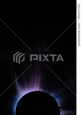 Close up of multi coloured powder and bowl with copy space on black background 99435783