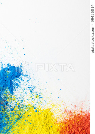 Close up of multi coloured powder and copy space on white background 99436014