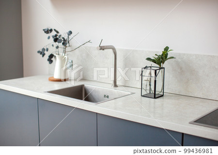 Kitchen worktop, sink close-up. 99436981
