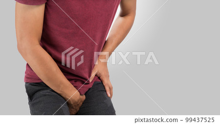 Man having groin pain. 99437525