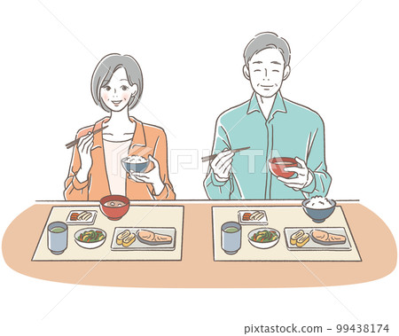 Senior men and women eating with a smile 99438174