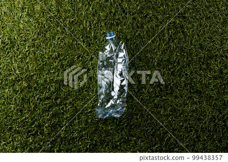 Close up of plastic bottle on grass background with copy space 99438357