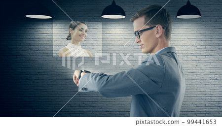 Composition of caucasian businessman using smartwatch displaying caucasian woman over wall 99441653