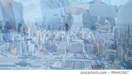 Composition of businessman hand shake in office over cityscape Composition of businessman hand shake in office over cityscape 99442067