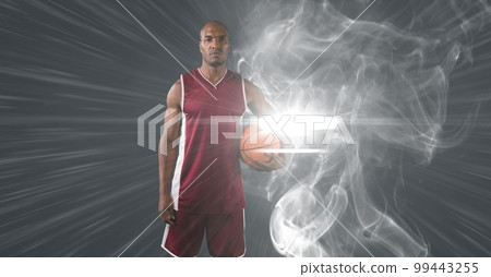 Composition of male basketball player holding basketball with copy space 99443255