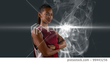 Composition of female basketball player with arms crossed with copy space 99443256