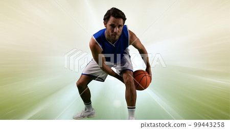 Composition of male basketball player holding basketball with copy space 99443258
