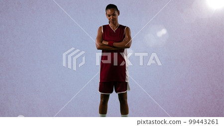 Composition of female basketball player with arms crossed with copy space Composition of female basketball player with arms crossed with copy space 99443261
