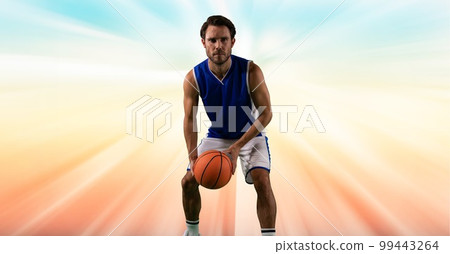 Composition of male basketball player holding basketball with copy space Composition of male basketball player holding basketball with copy space 99443264