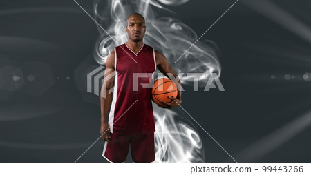 Composition of male basketball player holding basketball with copy space Composition of male basketball player holding basketball with copy space 99443266