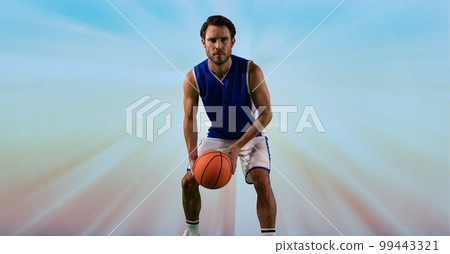Composition of male basketball player holding basketball with copy space 99443321