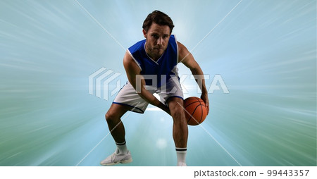 Composition of male basketball player holding basketball with copy space 99443357