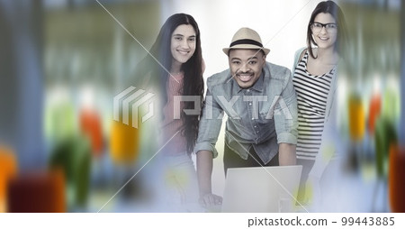 Composition of happy diverse business team using laptop with double exposure 99443885