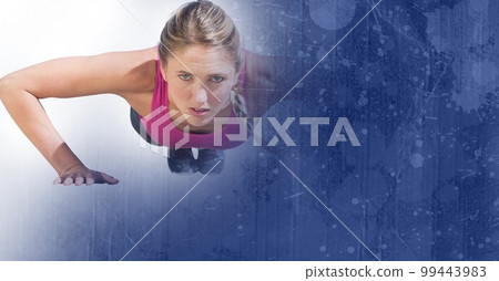 Composition of fit caucasian woman doing press ups in gym with blue blur 99443983