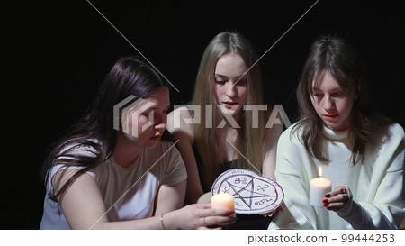 Three young women summon ghosts. horror 99444253