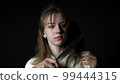 Maniac killer pursuing beautiful young woman with knife, attack on defenceless victim 99444315