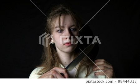 Maniac killer pursuing beautiful young woman with knife, attack on defenceless victim Maniac killer pursuing beautiful young woman with knife, attack on defenceless victim 99444315