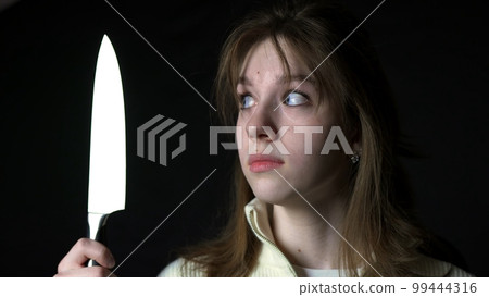 Maniac killer pursuing beautiful young woman with knife, attack on defenceless victim Maniac killer pursuing beautiful young woman with knife, attack on defenceless victim 99444316