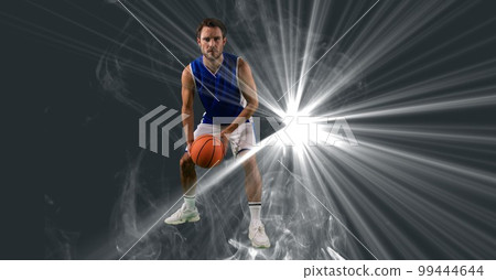 Composition of male basketball player holding basketball with copy space 99444644