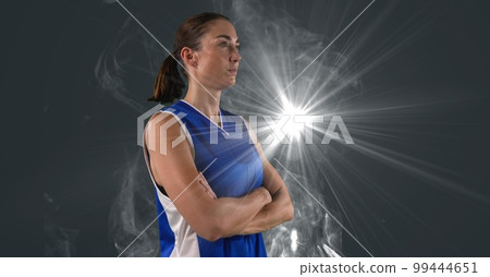 Composition of female basketball player with arms crossed with copy space 99444651