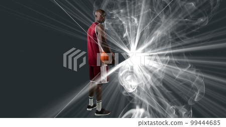 Composition of male basketball player holding basketball with copy space Composition of male basketball player holding basketball with copy space 99444685