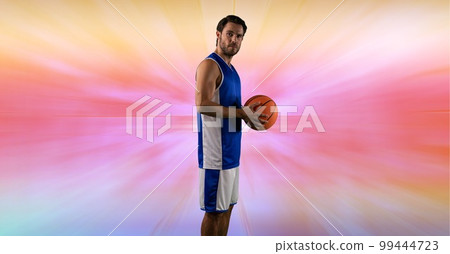 Composition of male basketball player holding basketball with copy space 99444723