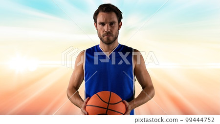 Composition of male basketball player holding basketball with copy space Composition of male basketball player holding basketball with copy space 99444752