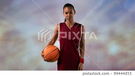 Composition of female basketball player holding basketball with copy space 99444855