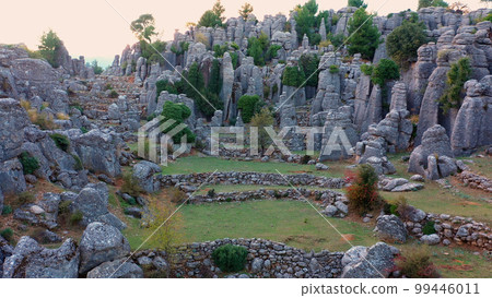 Landscape with granite rock formations and green coniferous trees. Scenic wild nature view from drone. Landscape with granite rock formations and green coniferous trees. Scenic wild nature view from drone. 99446011