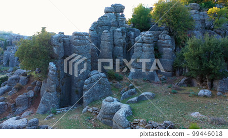 Beautiful landscape with beautiful rock formations and evergreen trees. Antalya, ancient city of Selge, Adam Kayalar, Turkey. Beautiful landscape with beautiful rock formations and evergreen trees. Antalya, ancient city of Selge, Adam Kayalar, Turkey. 99446018