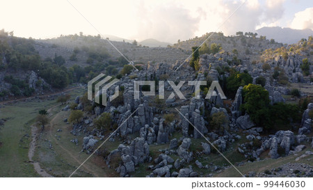 Aerial drone view of mountain valley with beautiful rock formations. Wild nature landscape in the morning. 99446030