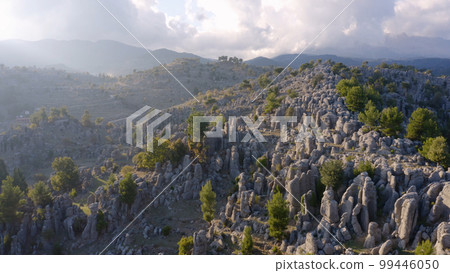 Amazing geological formations on mountains slopes. Aerial panoramic view from drone. Nature scenery. Amazing geological formations on mountains slopes. Aerial panoramic view from drone. Nature scenery. 99446050
