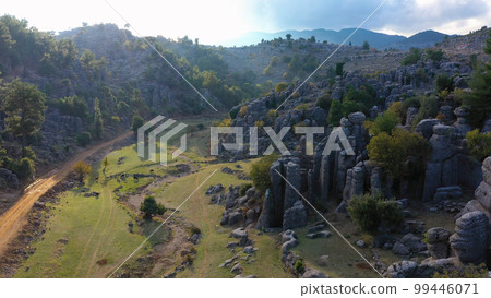 Scenic landscape with beautiful rock formations in mountain valley. Aerial view from drone. 99446071
