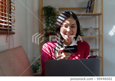 E-Business, Online shopping concept. Asian woman makes a purchase online shopping with credit card. 99446082